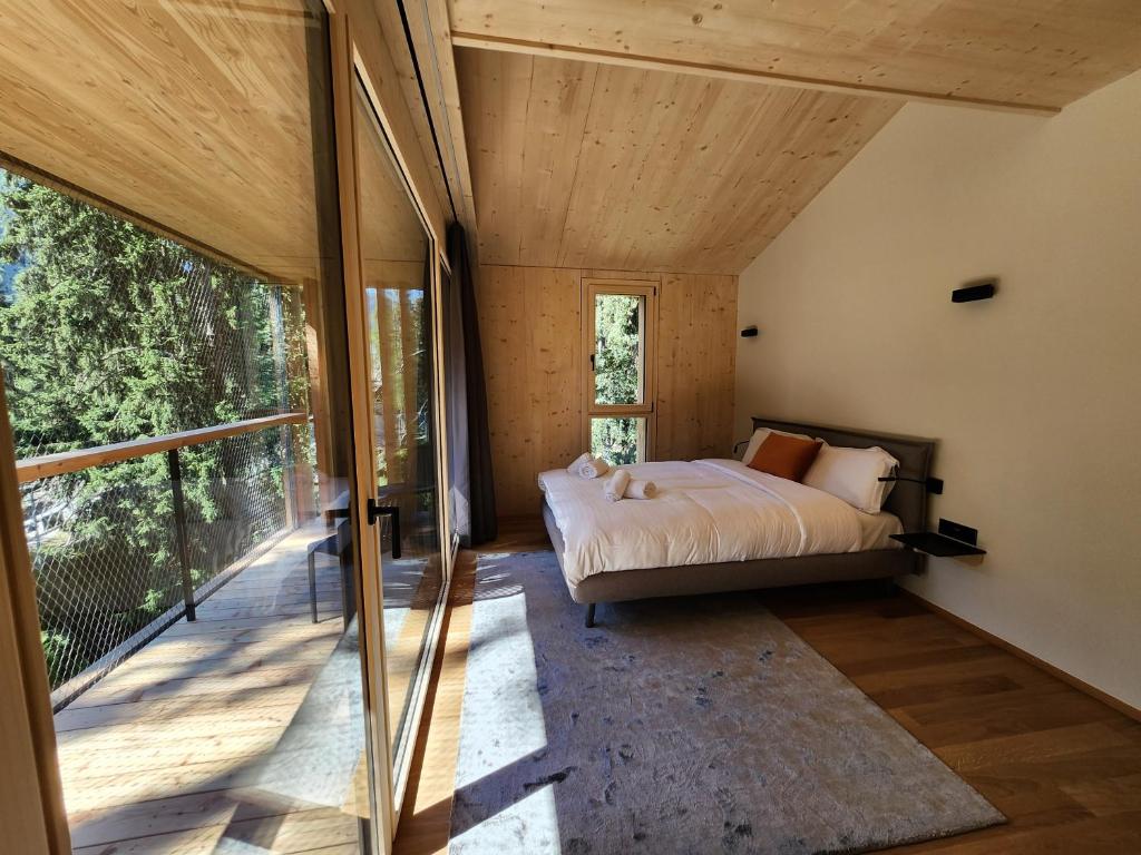 Postel nebo postele na pokoji v ubytování Zoo des Marécottes Boutique Hôtel
