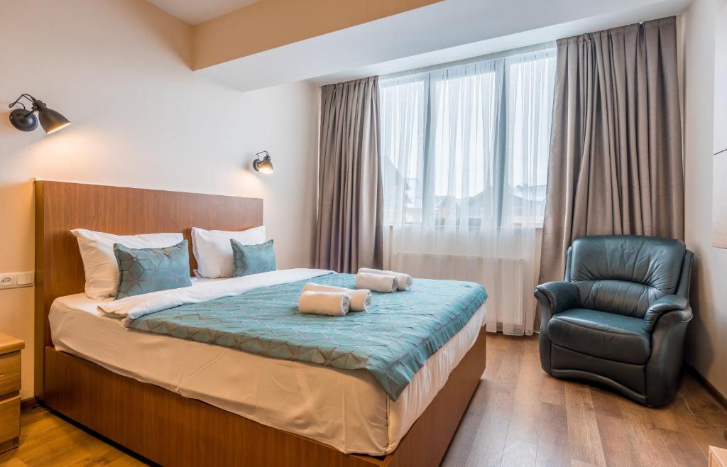 Postel nebo postele na pokoji v ubytování New Gudauri NG Rooms