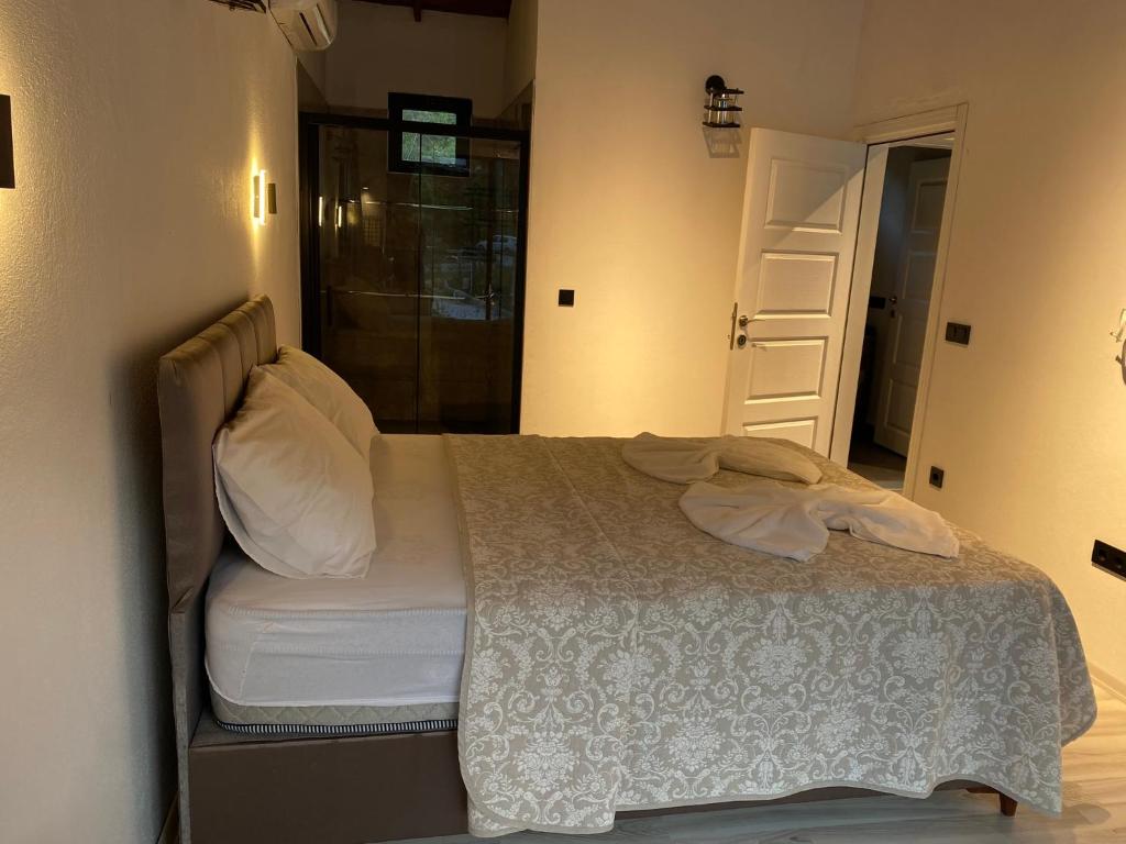 Postel nebo postele na pokoji v ubytování Zirkon Valley Boutique Hotel