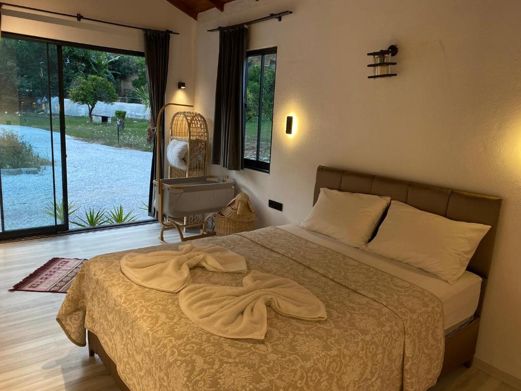 Postel nebo postele na pokoji v ubytování Zirkon Valley Boutique Hotel