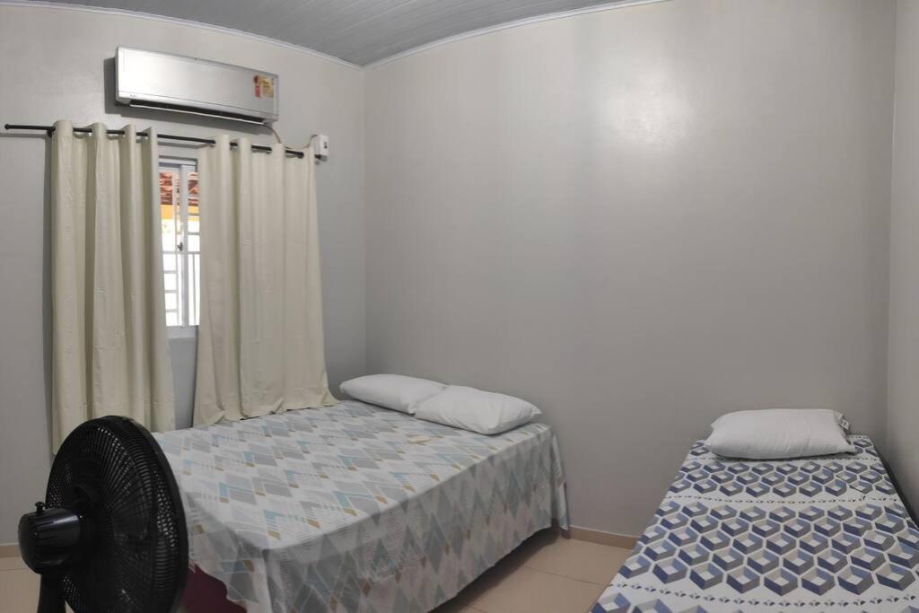 Postel nebo postele na pokoji v ubytování Residência Veloso 713