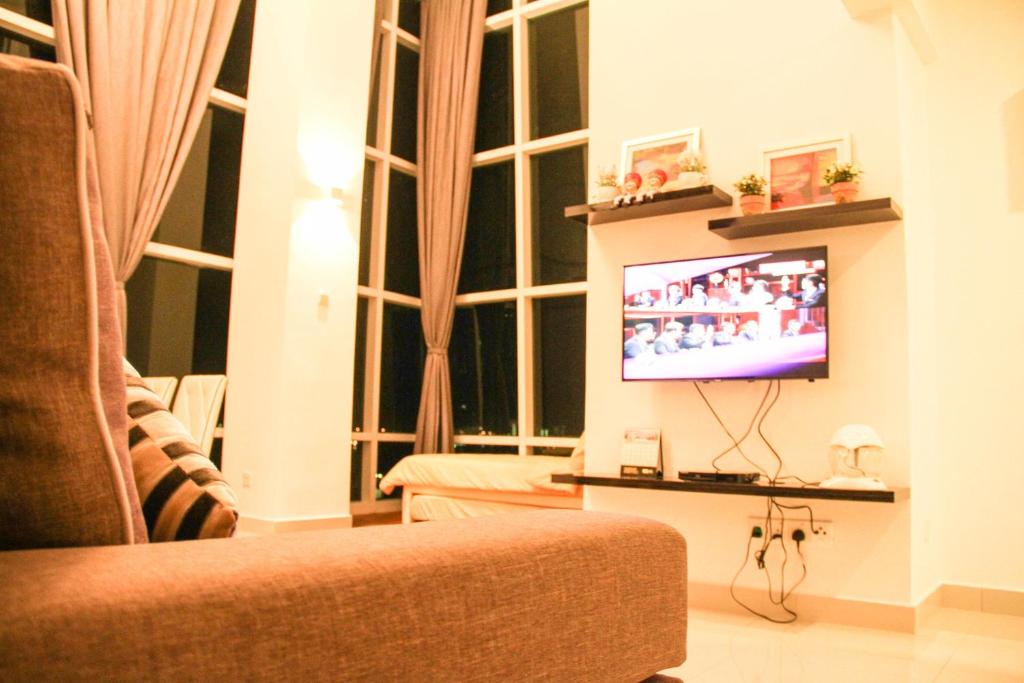 TV a/nebo společenská místnost v ubytování Premier Suite at Maritime