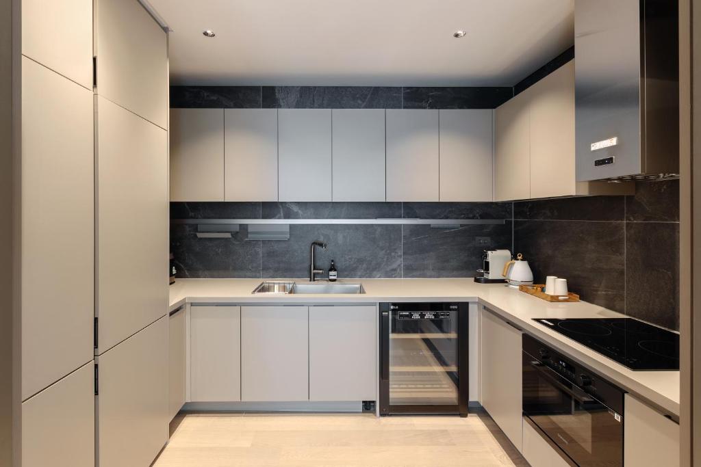Kuchyň nebo kuchyňský kout v ubytování NewCZ Haeundae Residence