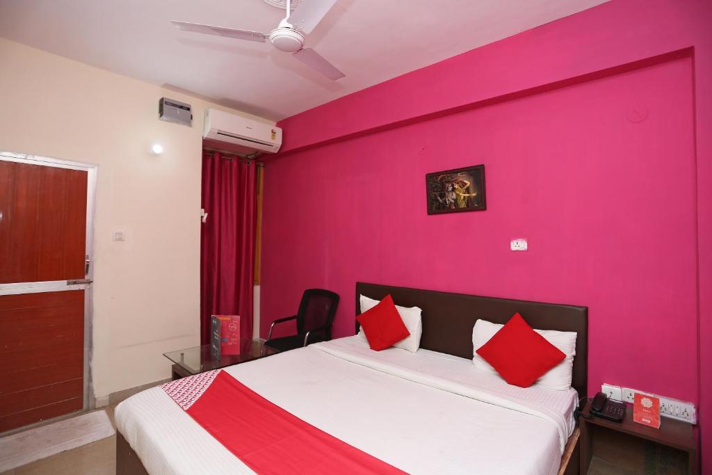 Postel nebo postele na pokoji v ubytování Vibrant Guest House