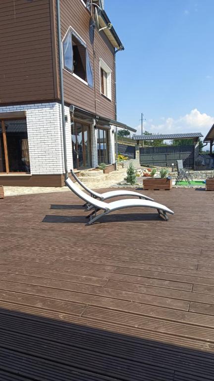a white object sitting on a patio in front of a house at UnderДіл in Krivopolʼye