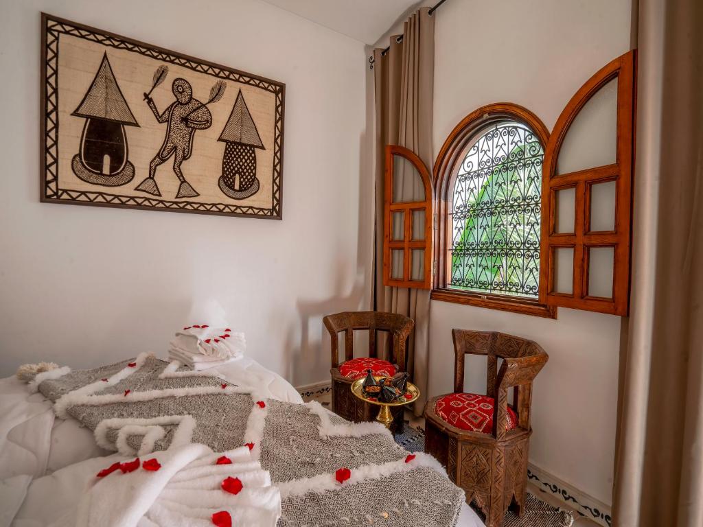Postel nebo postele na pokoji v ubytování Riad Le Nid De Fatima
