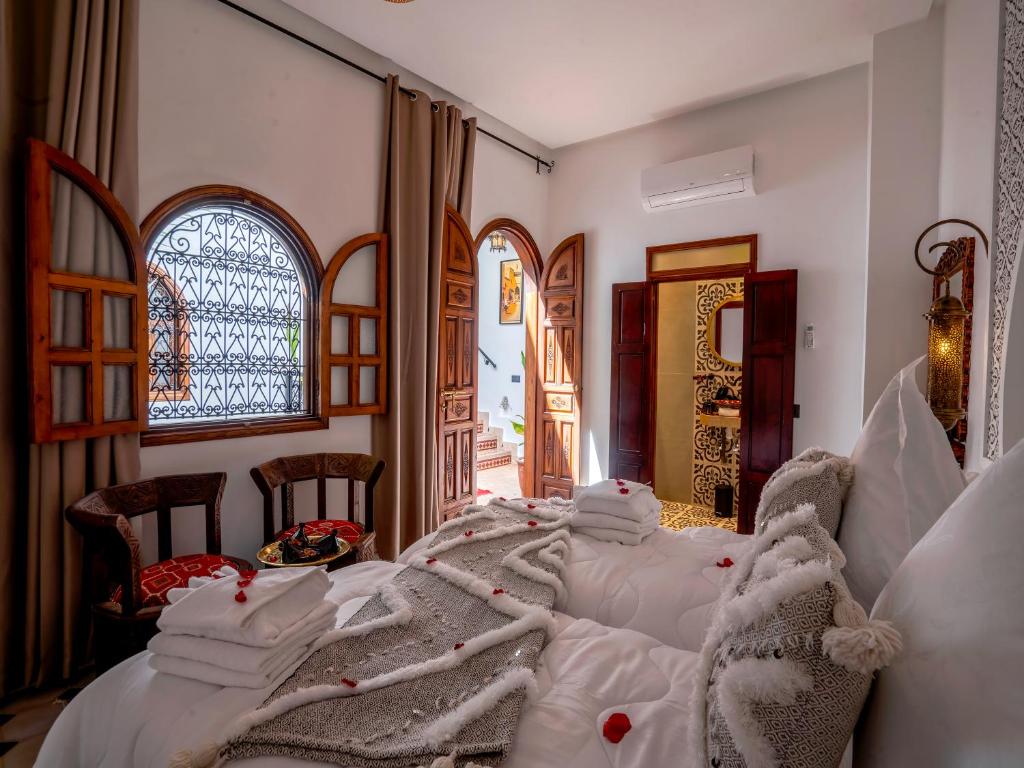 Postel nebo postele na pokoji v ubytování Riad Le Nid De Fatima