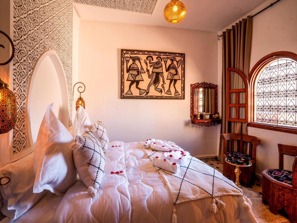 Postel nebo postele na pokoji v ubytování Riad Le Nid De Fatima