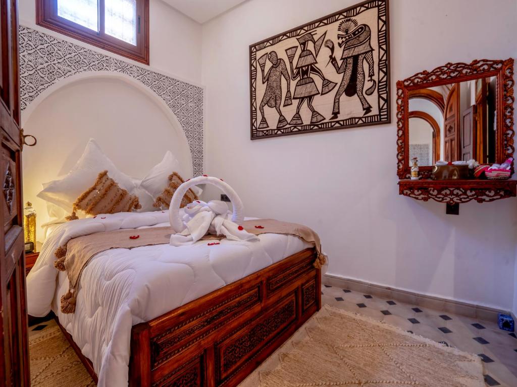 Postel nebo postele na pokoji v ubytování Riad Le Nid De Fatima