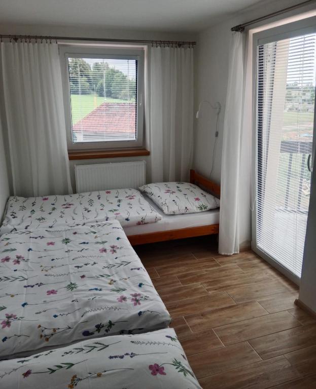 Postel nebo postele na pokoji v ubytování Ubytování U Křivánků 2