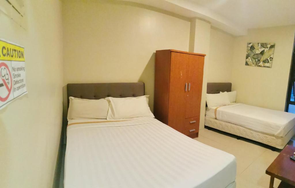 Postel nebo postele na pokoji v ubytování Hotel Elegant La Union