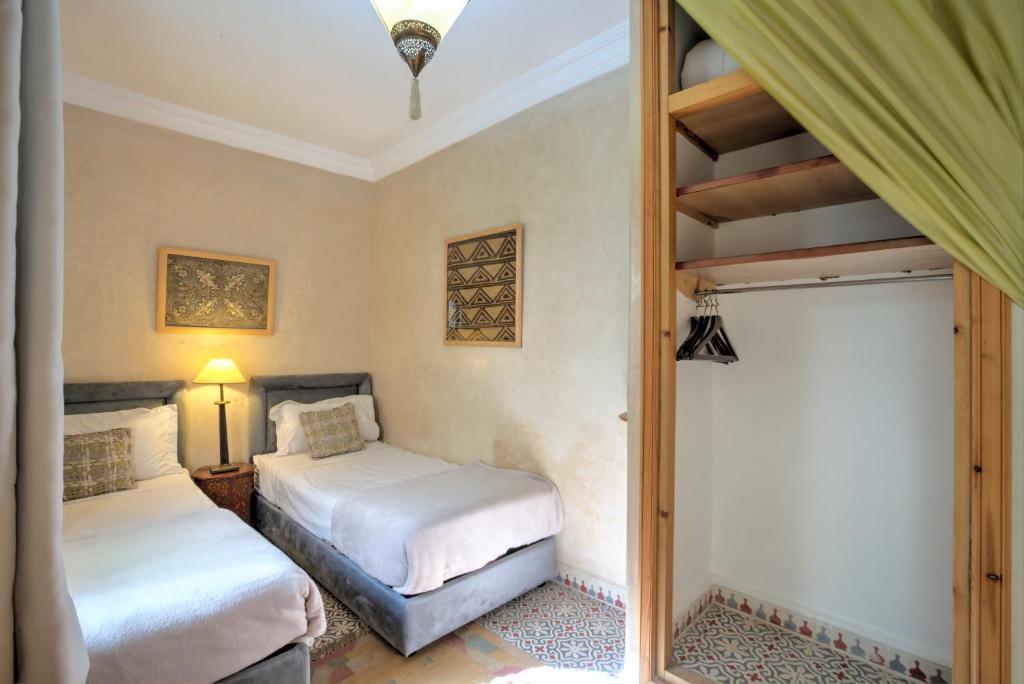 Postel nebo postele na pokoji v ubytování Riad Inaka