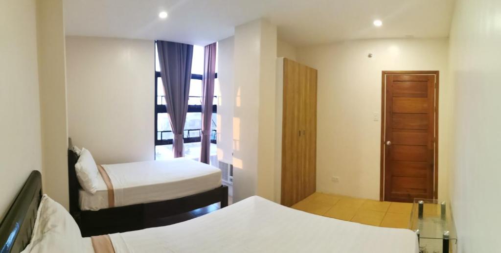 Postel nebo postele na pokoji v ubytování Hotel Elegant La Union
