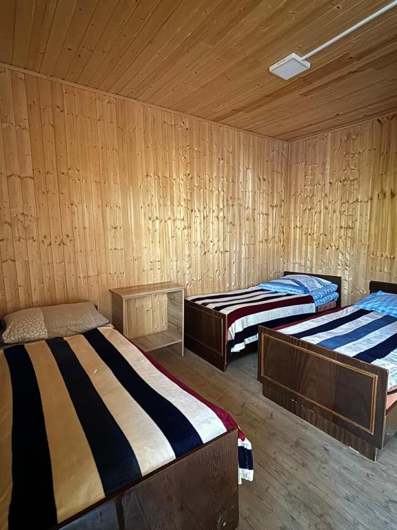 Postel nebo postele na pokoji v ubytování Family Hostel Nika