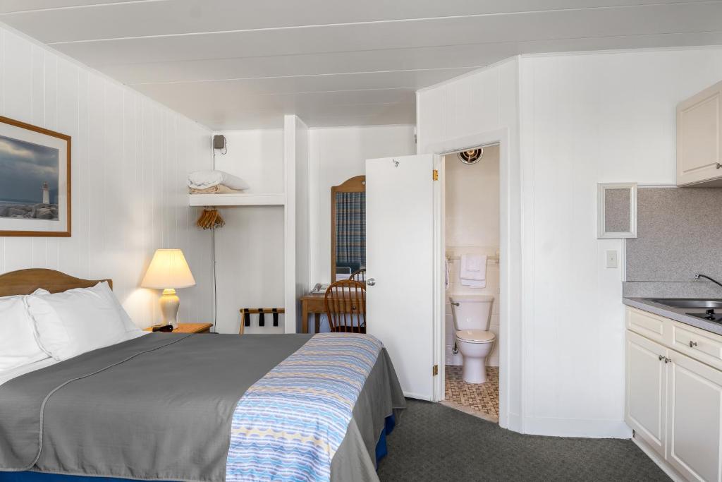 Postel nebo postele na pokoji v ubytování Lark Motel