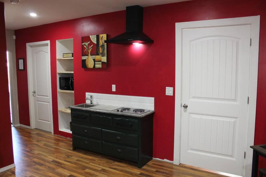 A kitchen or kitchenette at Cozy Lodge Suite