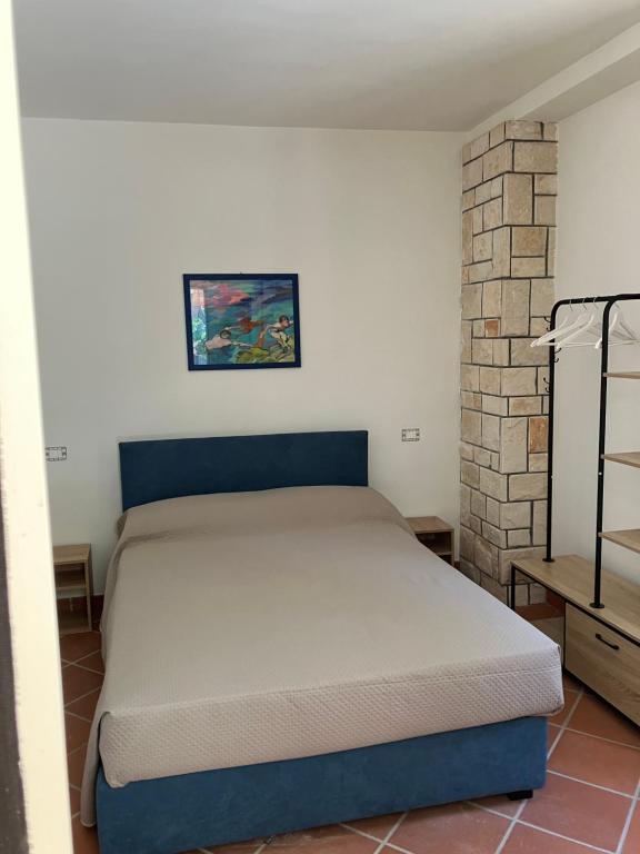 a bedroom with a bed in a room at Villetta in pineta in Gallipoli