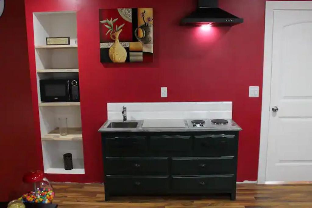A kitchen or kitchenette at Cozy Lodge Suite