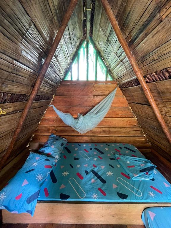 Postel nebo postele na pokoji v ubytování Wira Pora Hostal