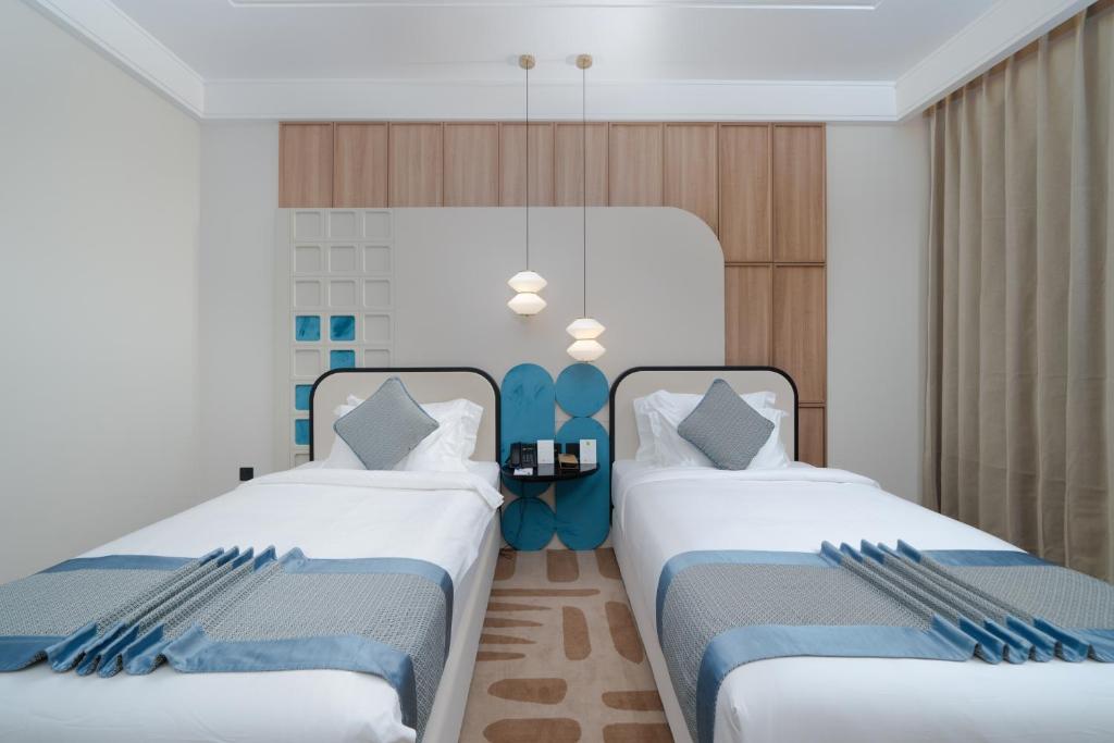 Postel nebo postele na pokoji v ubytování Sunway Tabuk Hotel