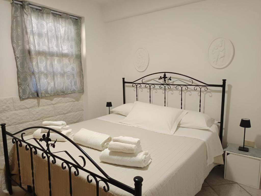 Ένα ή περισσότερα κρεβάτια σε δωμάτιο στο Villetta a Marzamemi a 50m dal mare