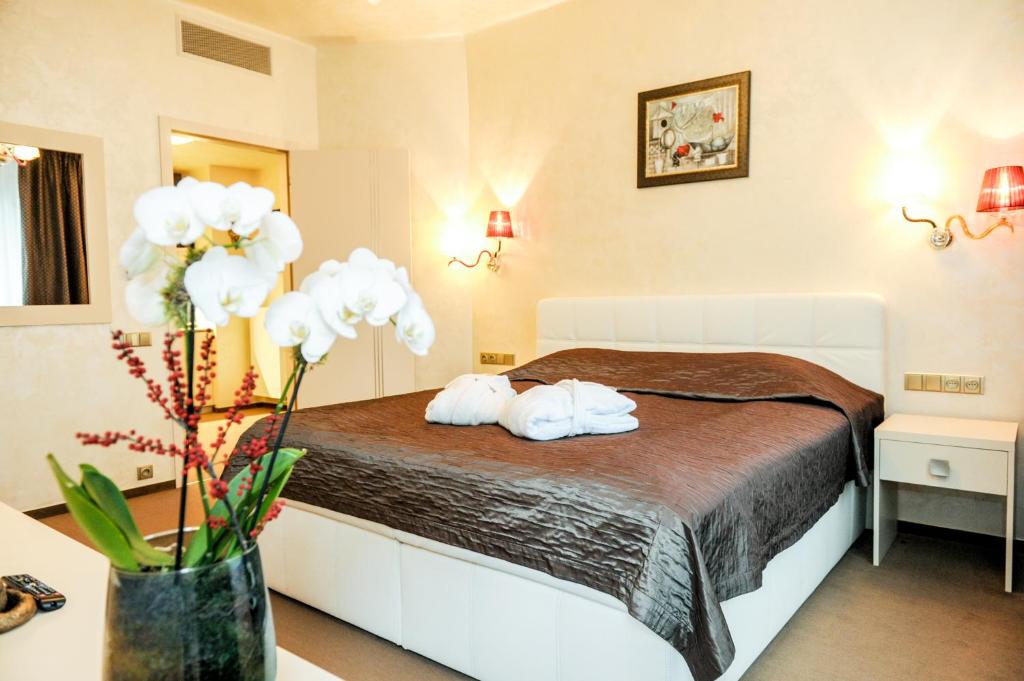 Postel nebo postele na pokoji v ubytování Myo Hotel Mysterius