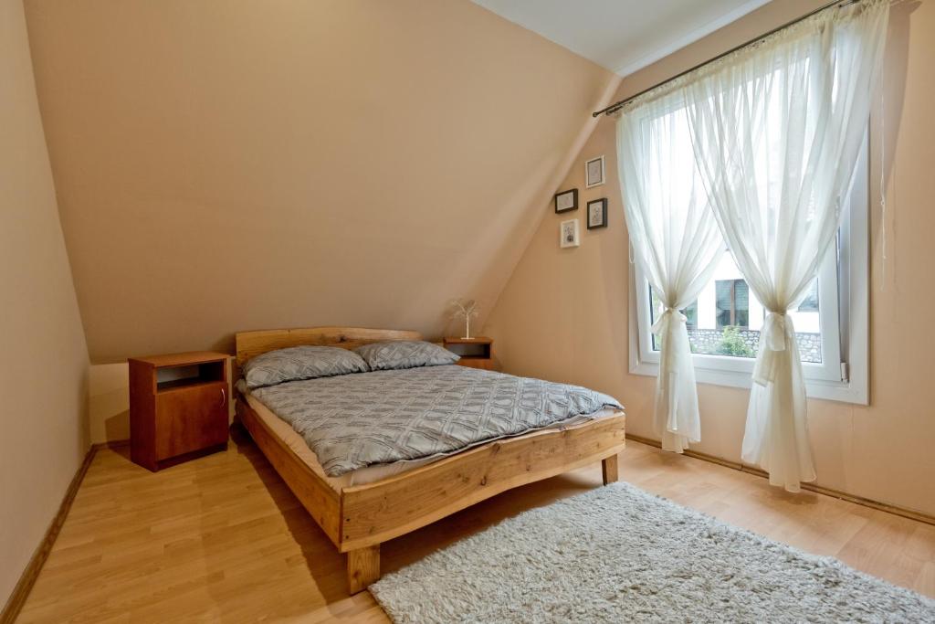 Postel nebo postele na pokoji v ubytování Domki Ranczo w Dolinie