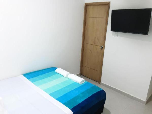 Voodi või voodid majutusasutuse Hostal Lumar toas