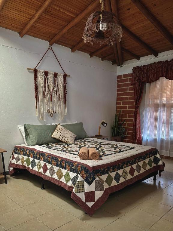 Postel nebo postele na pokoji v ubytování Casa Amaru
