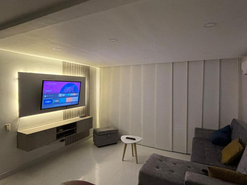 TV a/nebo společenská místnost v ubytování Apartamento de descanso Peñalisa Ricaurte