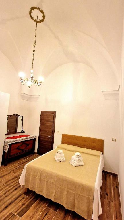 Postel nebo postele na pokoji v ubytování TRICASE Home