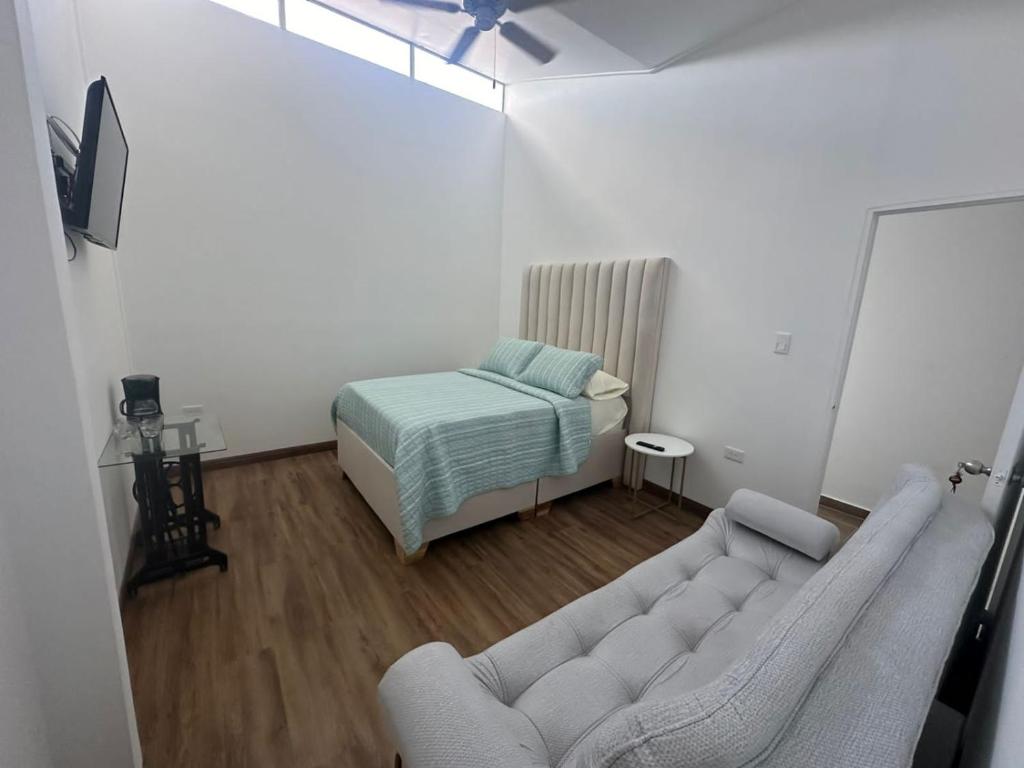 Postel nebo postele na pokoji v ubytování Casa colonial filandia