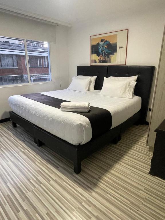 Postel nebo postele na pokoji v ubytování Hotel AMBAR KING