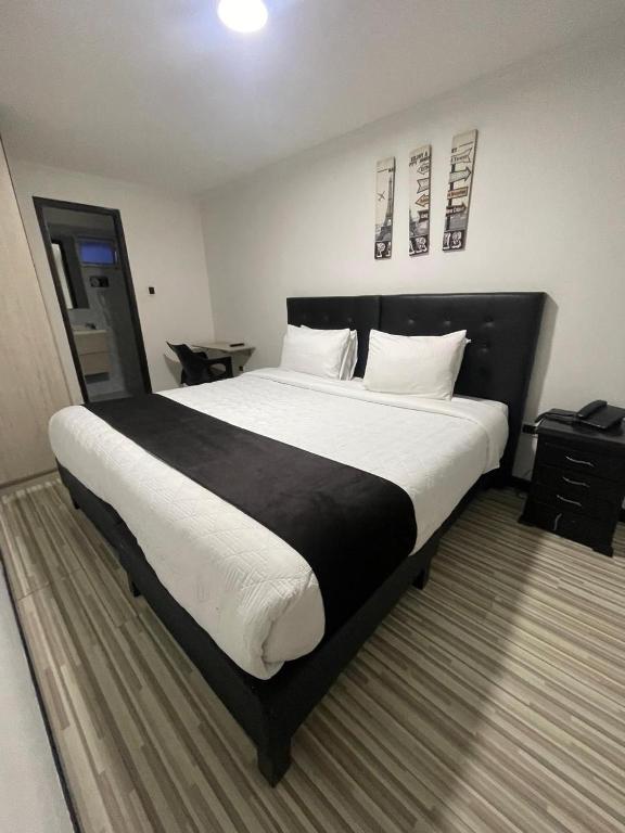 Postel nebo postele na pokoji v ubytování Hotel AMBAR KING