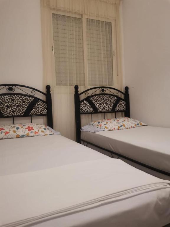 Postel nebo postele na pokoji v ubytování Appartement F3 en location d'été
