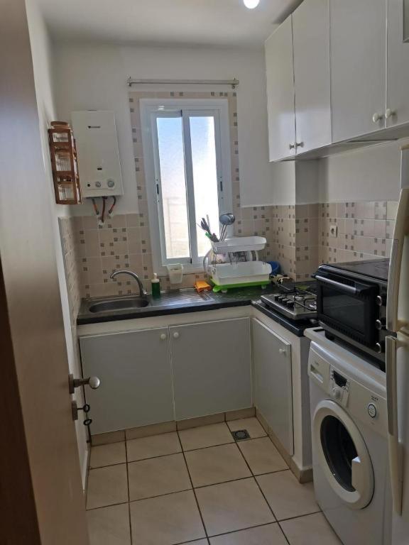 Kuchyň nebo kuchyňský kout v ubytování Appartement F3 en location d'été