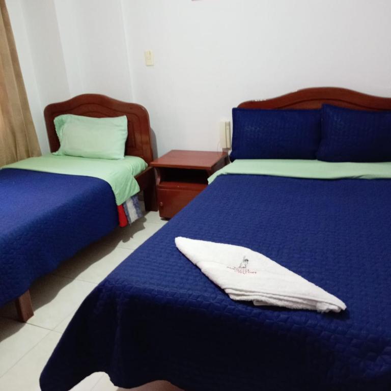 Postel nebo postele na pokoji v ubytování Hotel Manhattan City