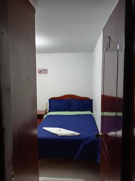 Postel nebo postele na pokoji v ubytování Hotel Manhattan City