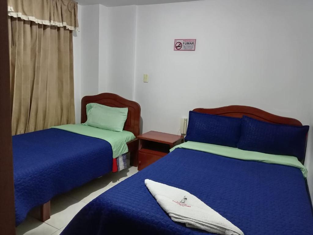 Postel nebo postele na pokoji v ubytování Hotel Manhattan City