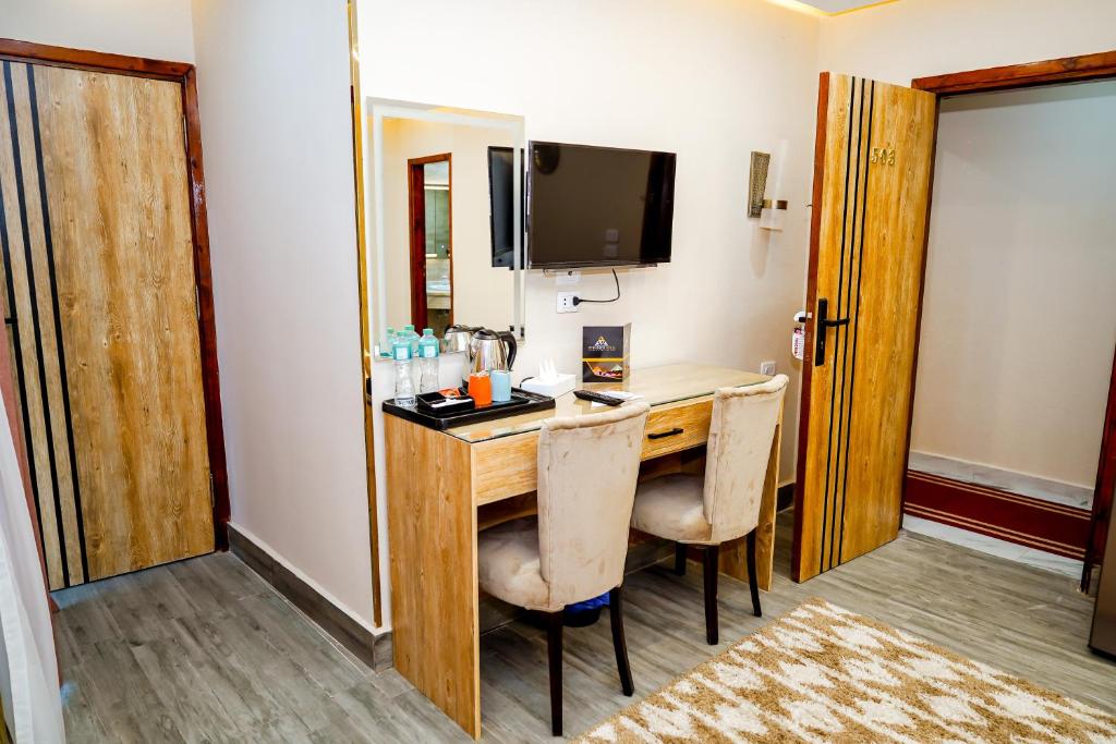 TV a/nebo společenská místnost v ubytování Pyramids Hotel