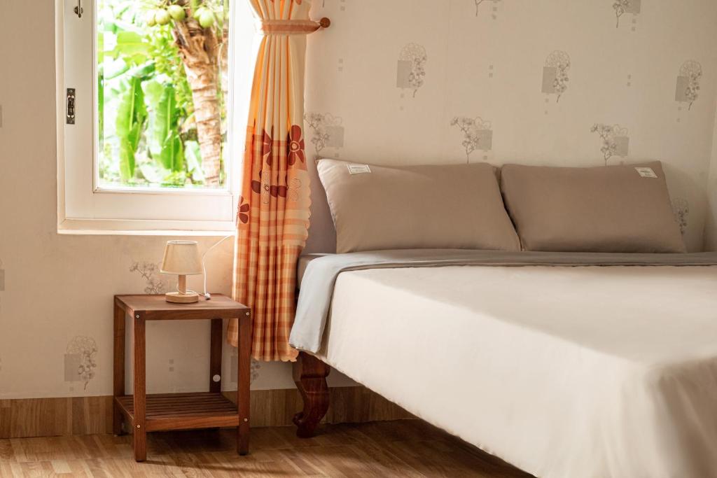 Postel nebo postele na pokoji v ubytování May's House