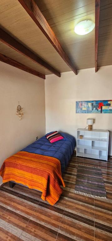 Postel nebo postele na pokoji v ubytování Hostal Belen