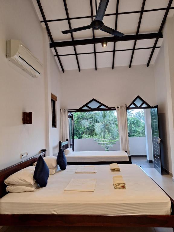 Rúm í herbergi á Villa Goodwill Paradise