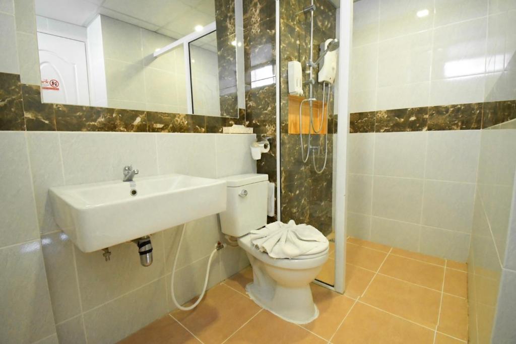 Koupelna v ubytování Family Hotel