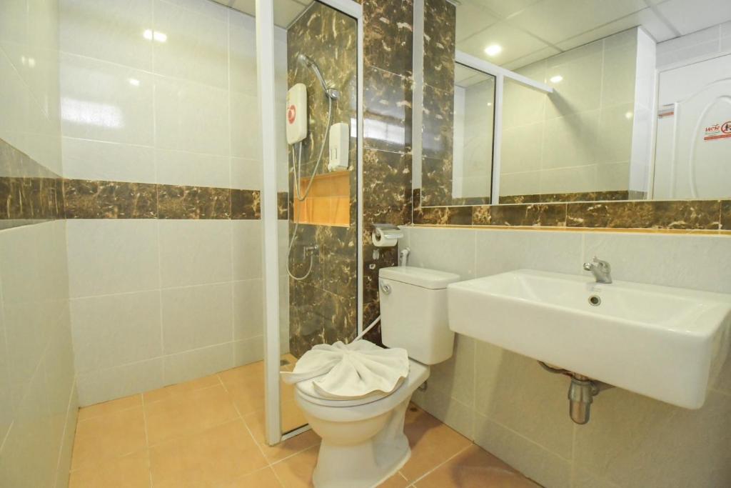 Koupelna v ubytování Family Hotel
