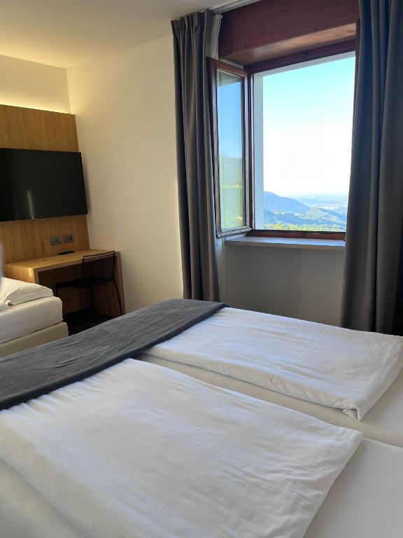 Postel nebo postele na pokoji v ubytování Hotel Belvedere