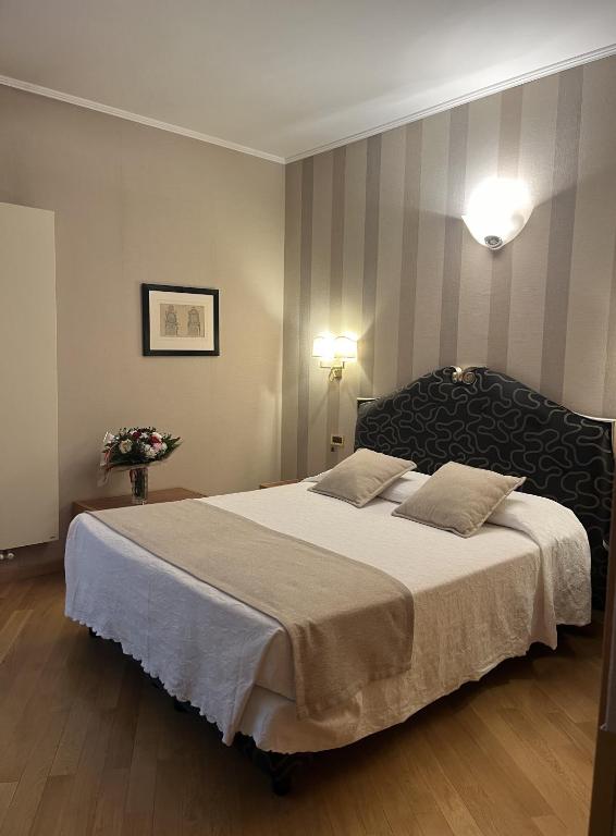 Postel nebo postele na pokoji v ubytování Hotel Europa