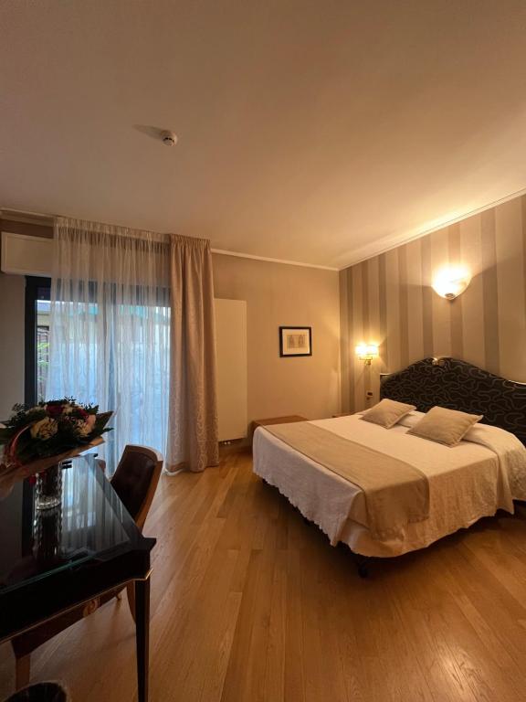 Postel nebo postele na pokoji v ubytování Hotel Europa