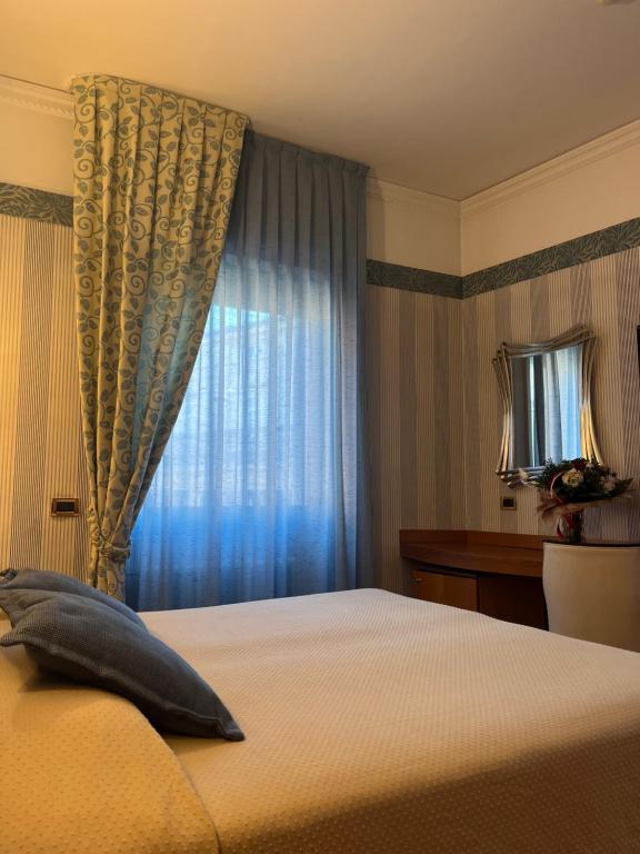 Postel nebo postele na pokoji v ubytování Hotel Europa