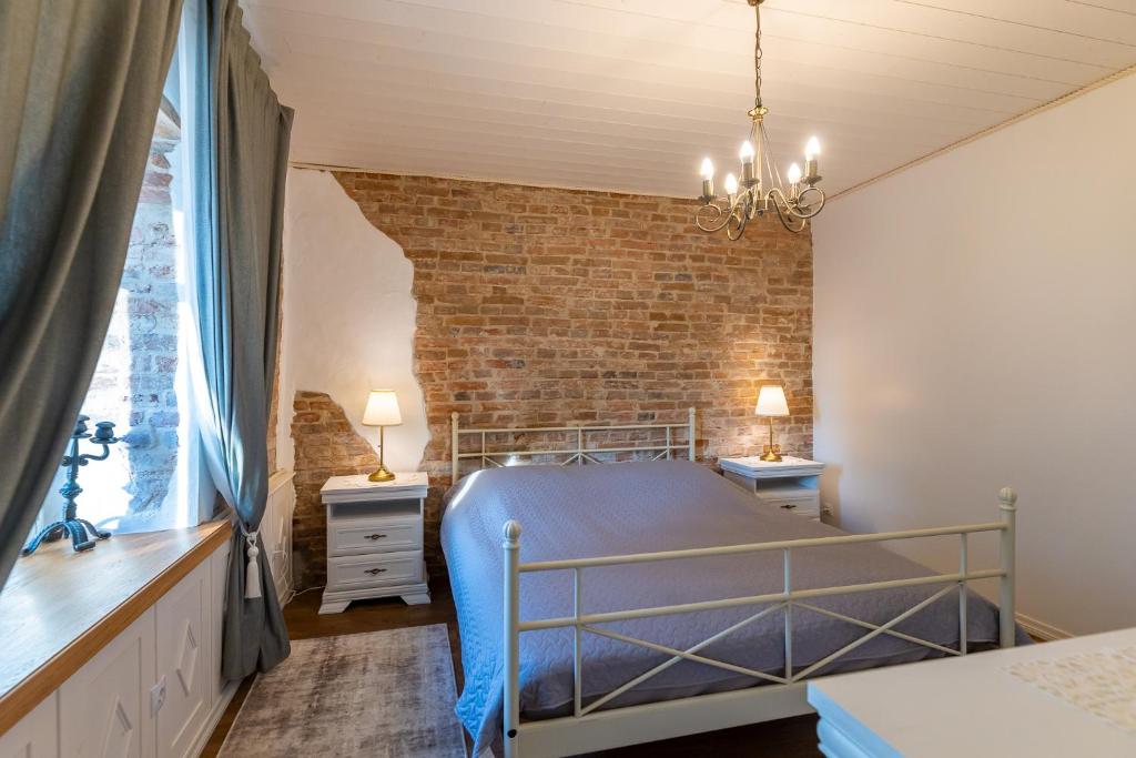 Voodi või voodid majutusasutuse Aadma Guesthouse toas